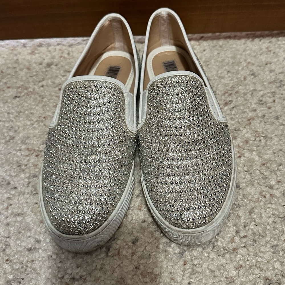 Sparkle and shine everywhere you go with these silver sneakers